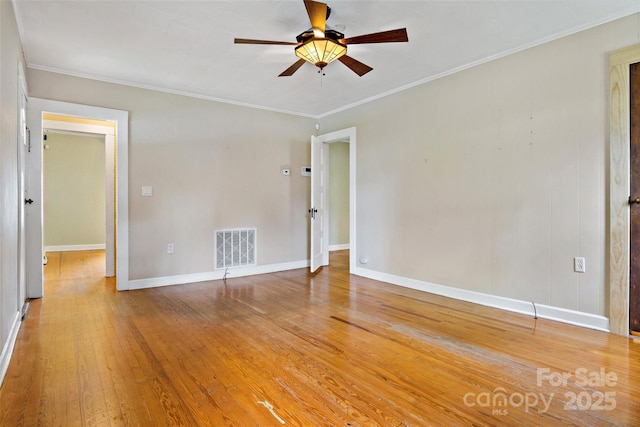 unfurnished room featuring wood-type flooring, ornamental molding, and ceiling fan