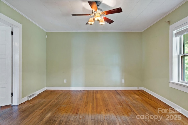 unfurnished room with crown molding, ceiling fan, plenty of natural light, and wood-type flooring