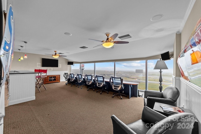 interior space with a wealth of natural light, ceiling fan, and carpet floors