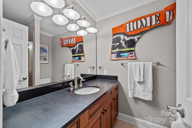full bathroom featuring toilet, crown molding, vanity, and visible vents