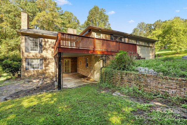 back of house featuring a patio area and a deck