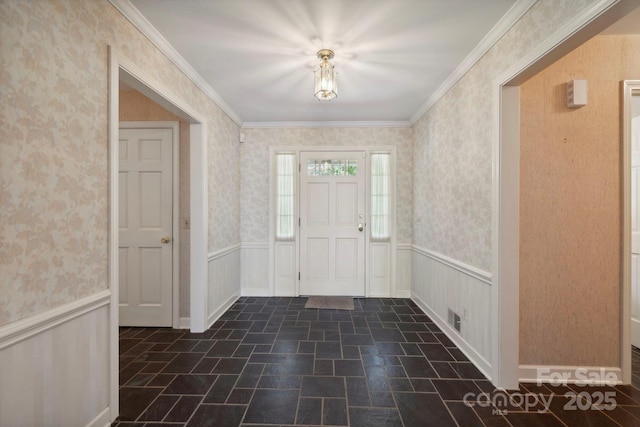 foyer entrance featuring crown molding