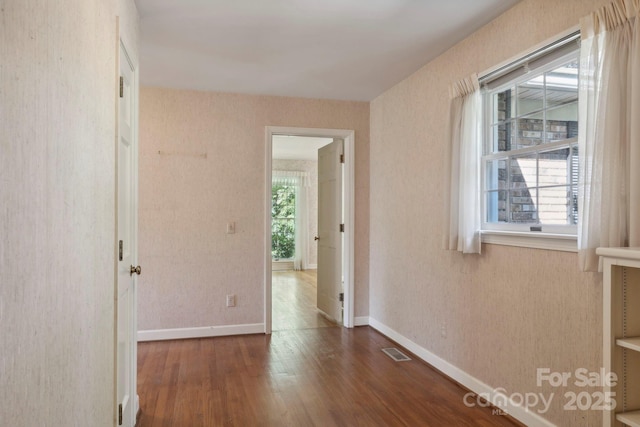 hall with dark hardwood / wood-style floors