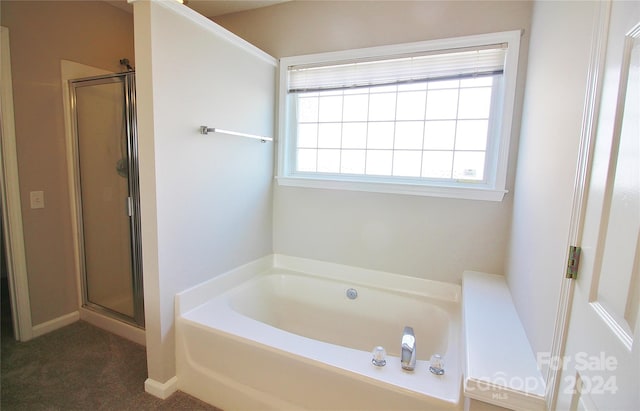 bathroom featuring plus walk in shower