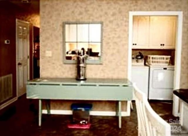 interior space featuring cabinets and washer and clothes dryer