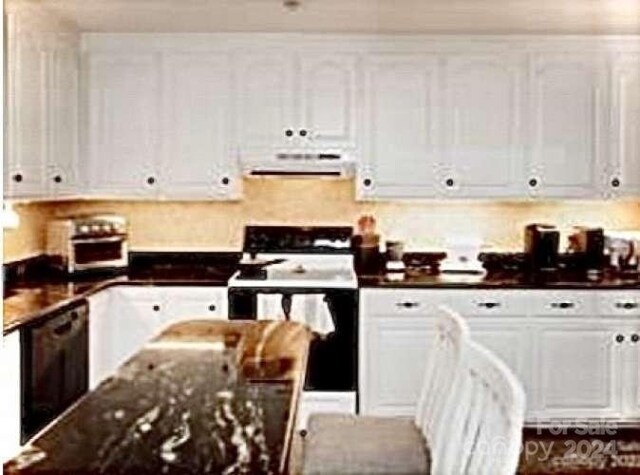 kitchen featuring white cabinets, dishwasher, white range with electric stovetop, dark stone counters, and exhaust hood