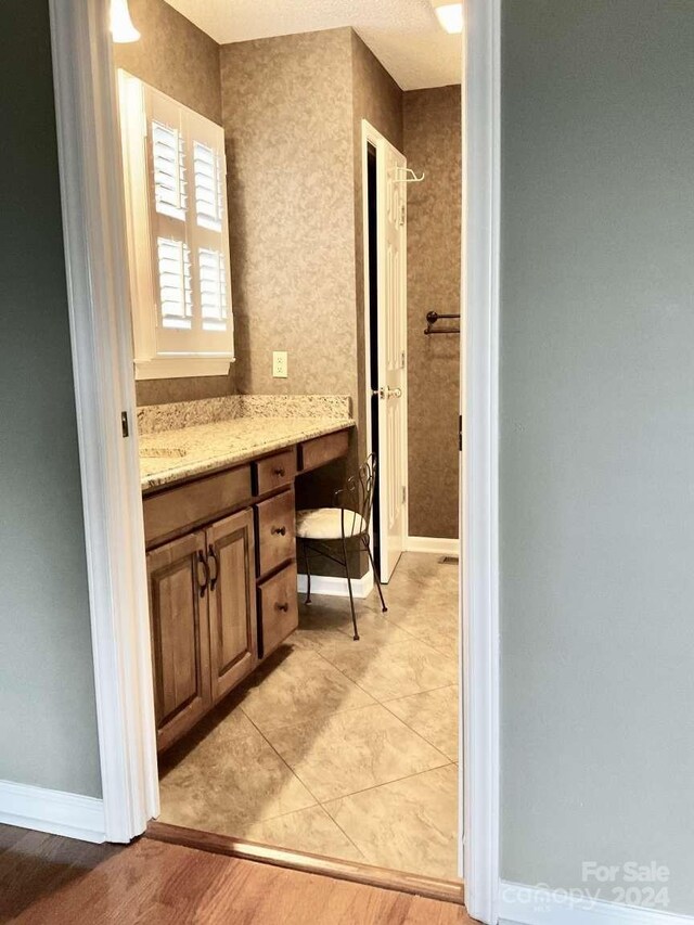 bathroom with vanity and hardwood / wood-style flooring