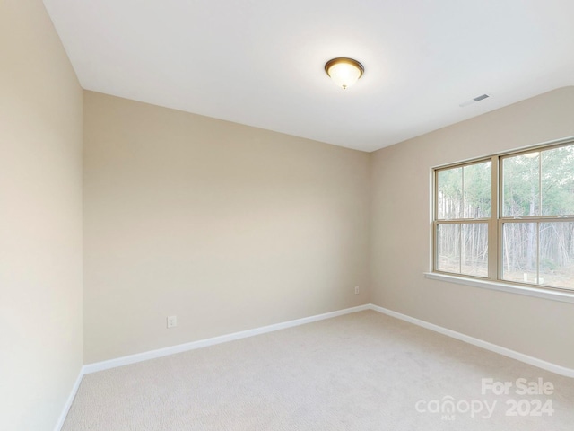 unfurnished room featuring carpet flooring