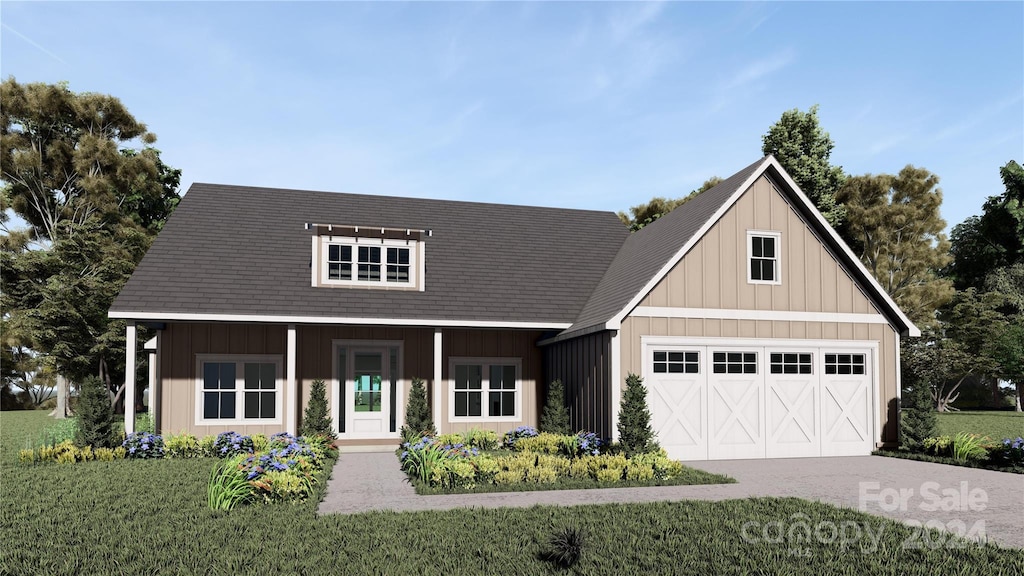 view of front facade featuring a garage and a front lawn