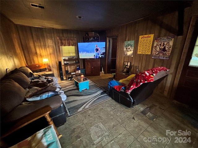 living room featuring wood walls