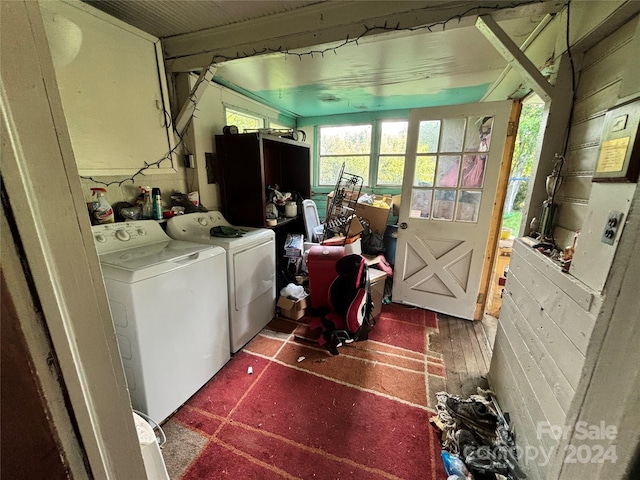 laundry room featuring hardwood / wood-style flooring and washing machine and dryer