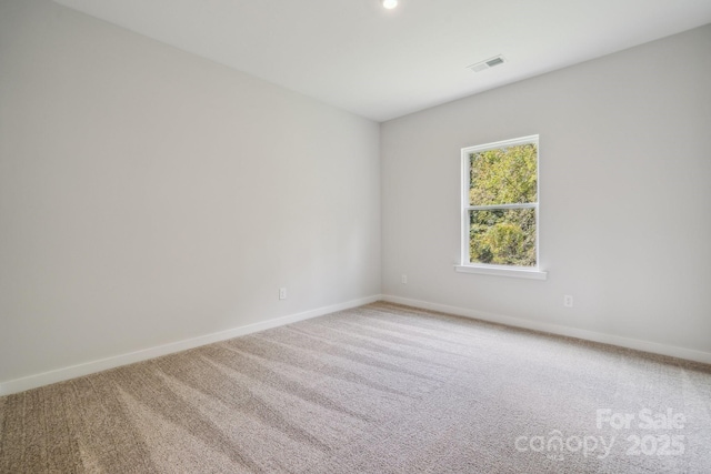 unfurnished room featuring carpet flooring