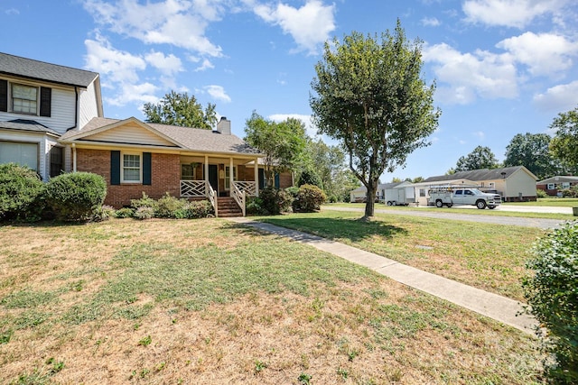 view of front of home with covered porch and a front yard