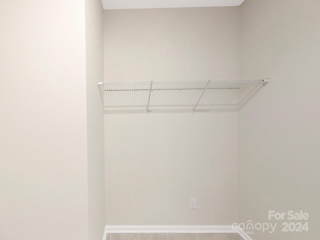 walk in closet featuring tile patterned floors