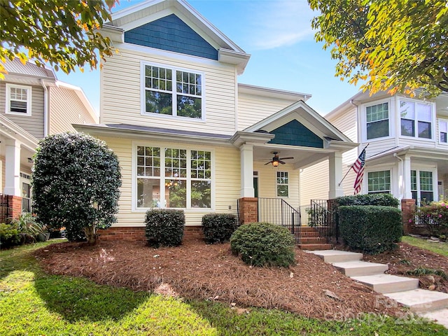 craftsman-style house with ceiling fan