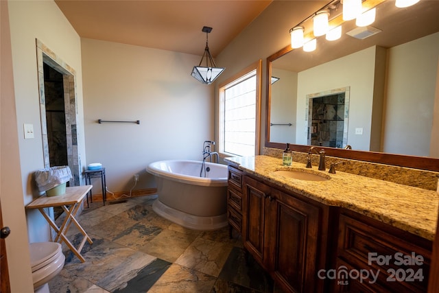 full bathroom featuring shower with separate bathtub, vanity, and toilet