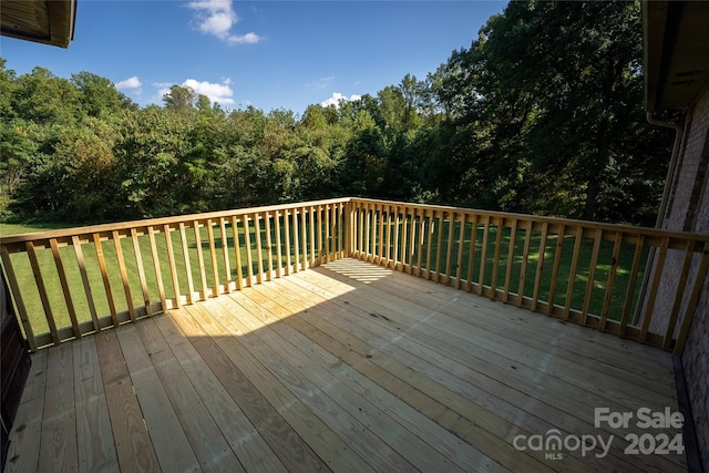 deck featuring a lawn