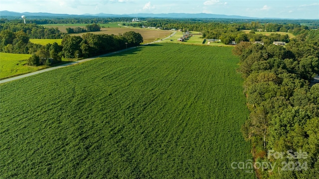 birds eye view of property with a rural view and a mountain view