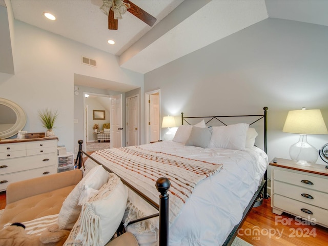 bedroom featuring high vaulted ceiling, ceiling fan, and light hardwood / wood-style flooring