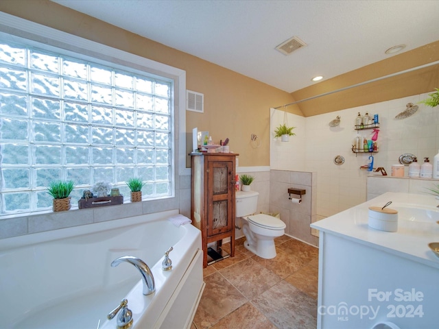 full bath with tile walls, toilet, a bath, and visible vents