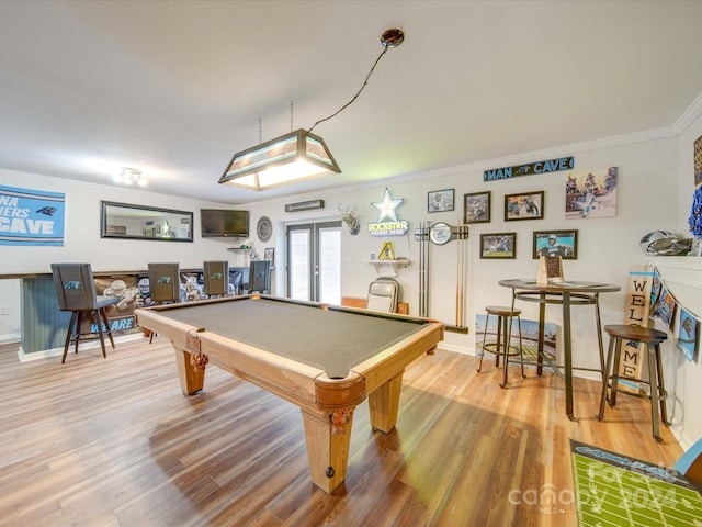 rec room featuring pool table, ornamental molding, french doors, and hardwood / wood-style flooring