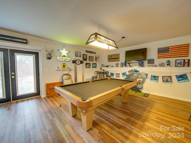 game room with hardwood / wood-style flooring, crown molding, and pool table