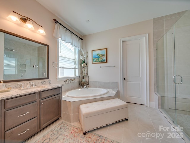 bathroom featuring tile patterned floors, vanity, and plus walk in shower