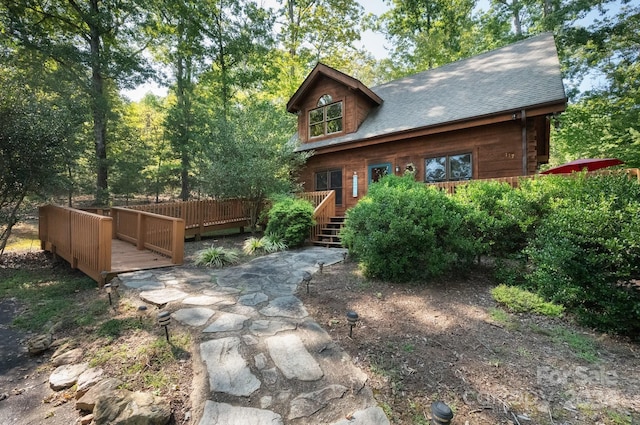 view of front of home featuring a wooden deck