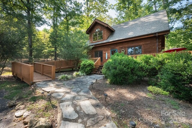 117 Laurel Lakes Pkwy, Lake Lure, NC 28746 - view of front of house with a deck and roof with shingles