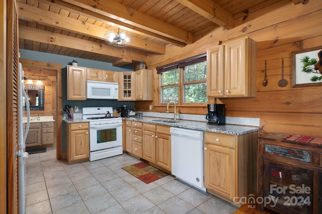 kitchen featuring beamed ceiling, white appliances, light stone countertops, wood ceiling, and sink