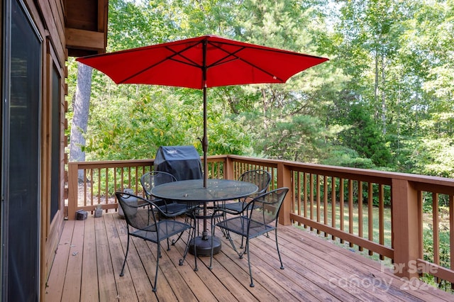 117 Laurel Lakes Pkwy, Lake Lure, NC 28746 - wooden deck featuring outdoor dining area and area for grilling