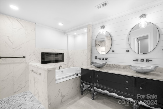 bathroom with ornamental molding, tiled tub, vanity, and heating unit