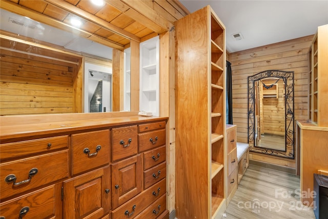 bathroom with wood ceiling, wood-type flooring, wood walls, and vanity