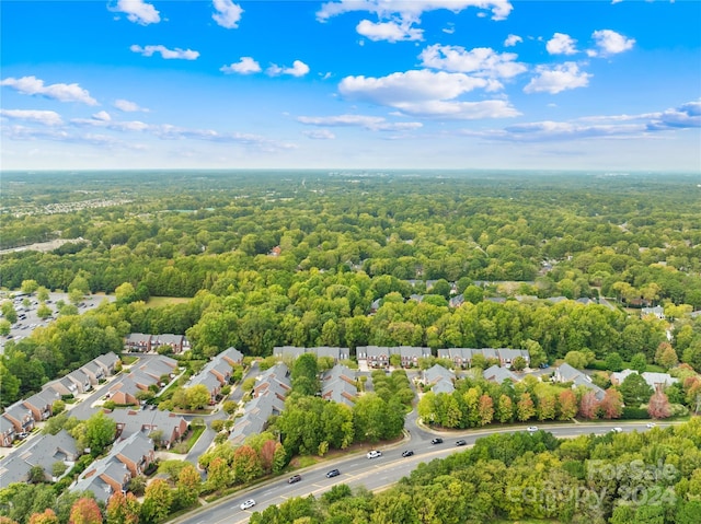 birds eye view of property with a residential view and a forest view