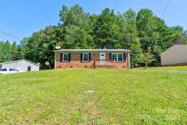 single story home with a front lawn