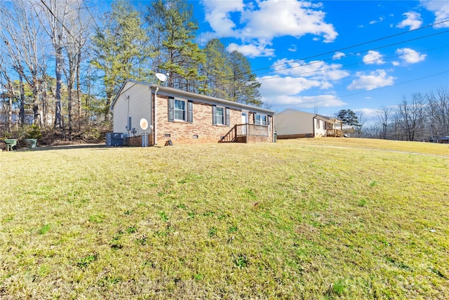 rear view of property with a yard