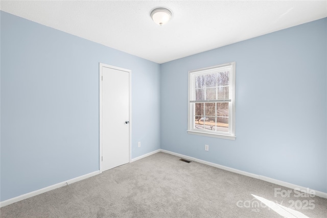 empty room featuring carpet floors