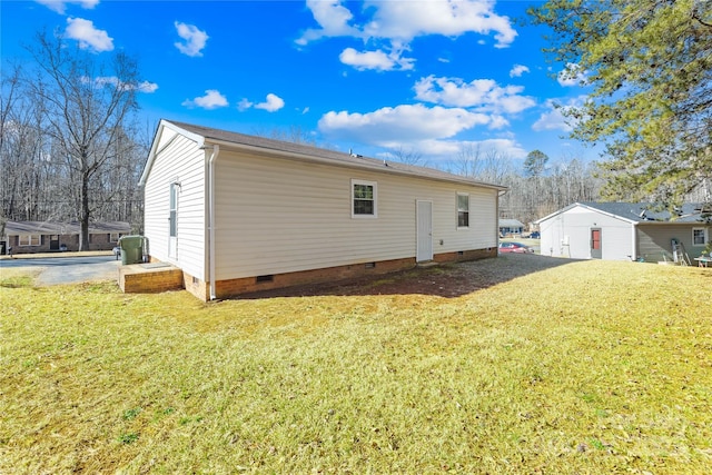 rear view of property with a lawn