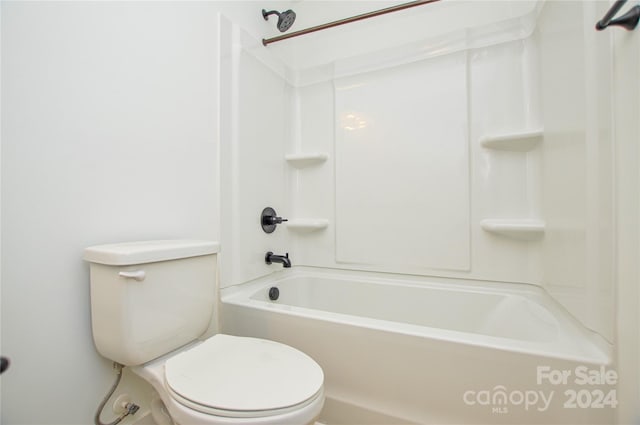 bathroom with shower / tub combination and toilet