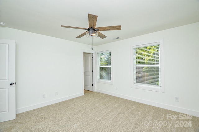 carpeted empty room with ceiling fan