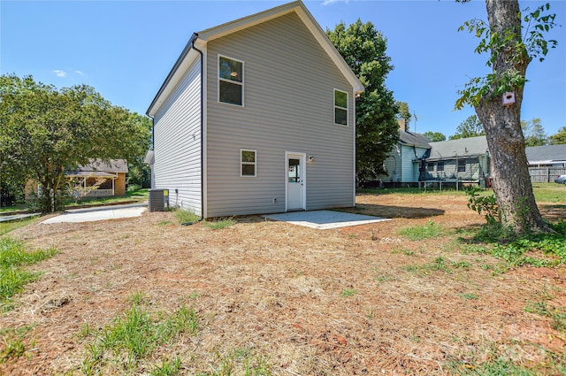 back of house featuring cooling unit and a patio area