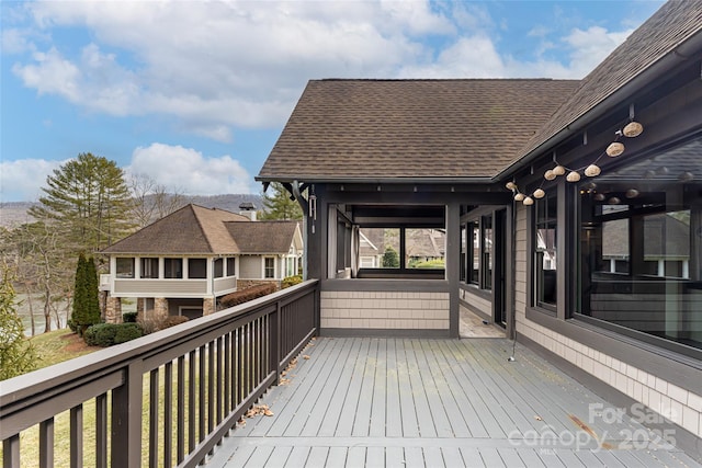 wooden terrace with a sunroom