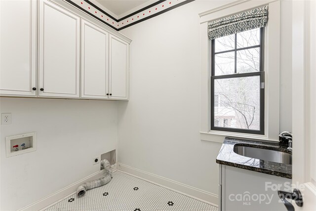 laundry room featuring cabinets, washer hookup, sink, and electric dryer hookup