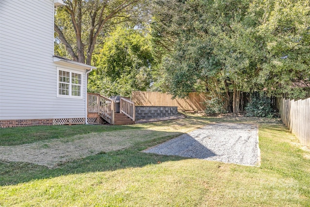 view of yard with a deck