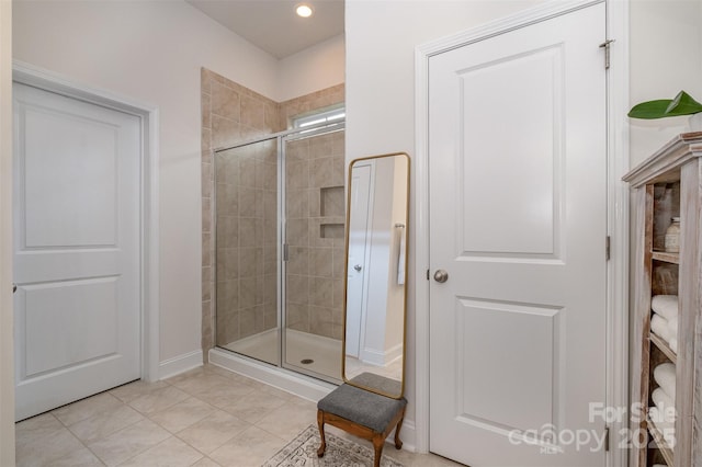 bathroom featuring tile patterned floors and an enclosed shower