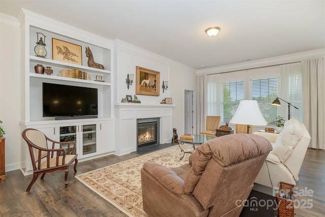 living room featuring dark hardwood / wood-style flooring and ornamental molding