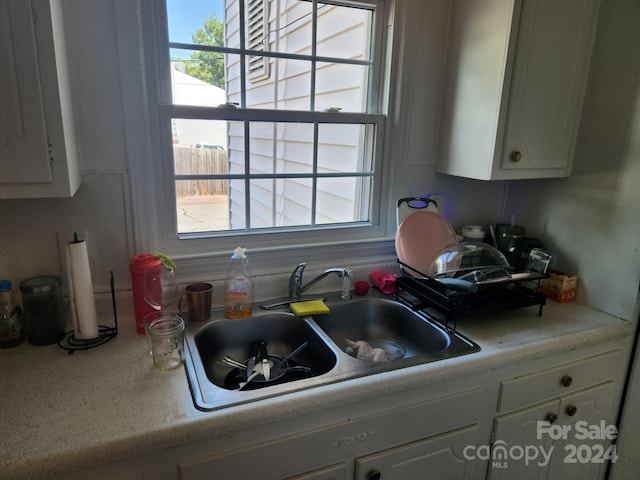 kitchen with sink and white cabinets