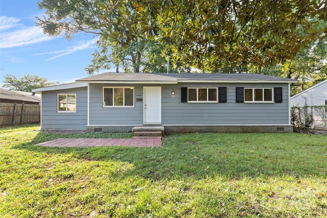 view of front facade with crawl space, a front yard, and fence