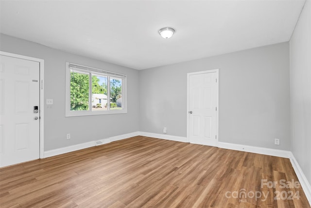 empty room featuring hardwood / wood-style floors