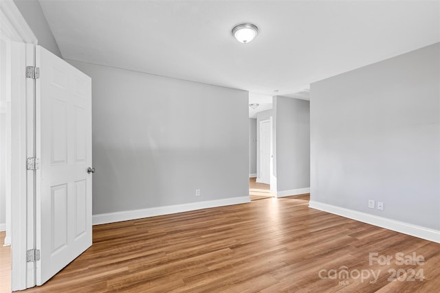 unfurnished room featuring hardwood / wood-style floors